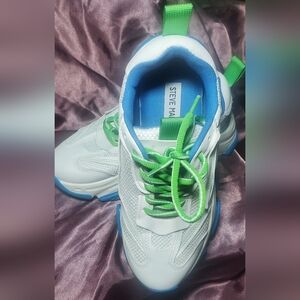 This is a pair of Steve Madden Possession chunky sneakers in white with green